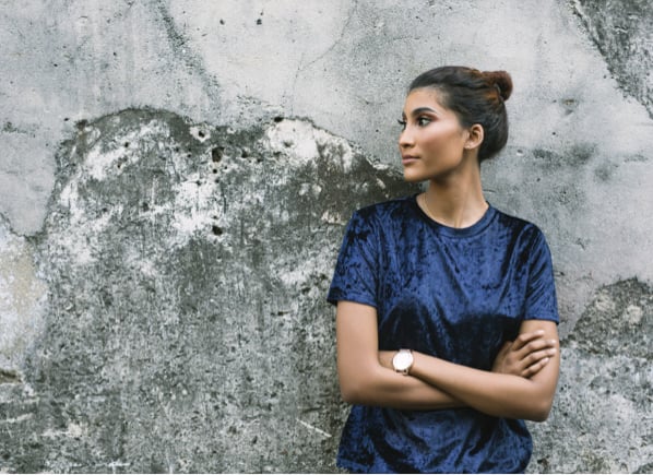 Woman holding up wall