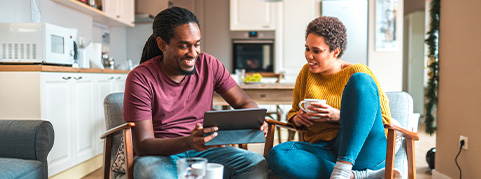 Two roommates working together on a laptop