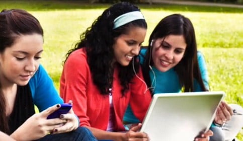 Students looking at a laptop